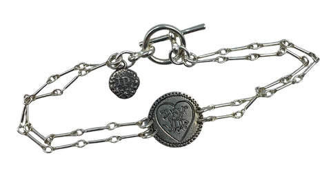 https://www.great-republic.com/collections/watches/products/antique-sterling-silver-1858-seated-liberty-coin-love-token-bracelet