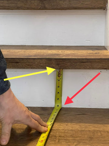 measuring stairs with a tape measure to determine the size of stair runner