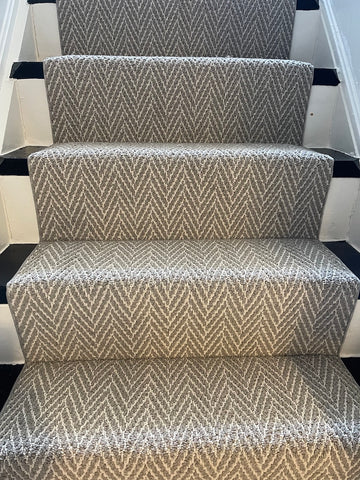 gray and white carpet runner for stairs