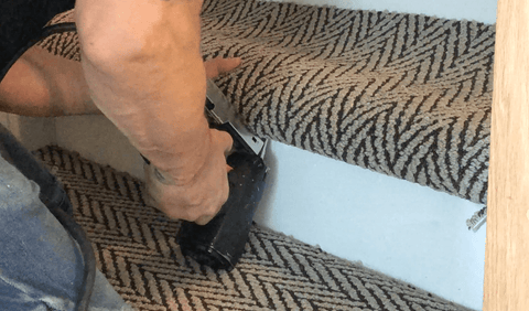 continuing stapling herringbone carpet stair tread