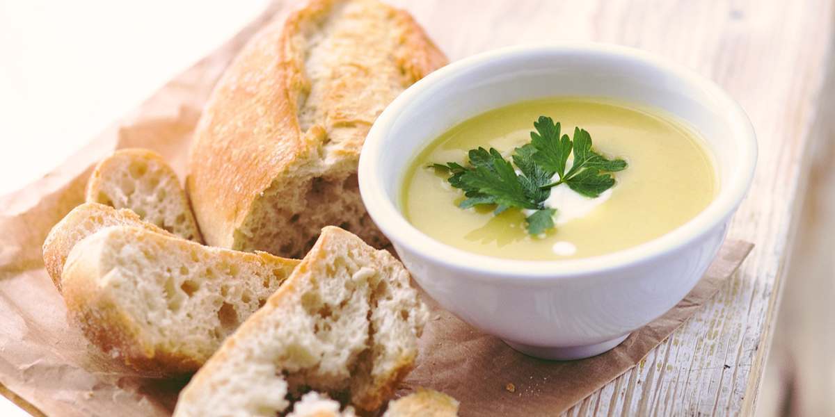Leek & Potato soup in a bowl with bread