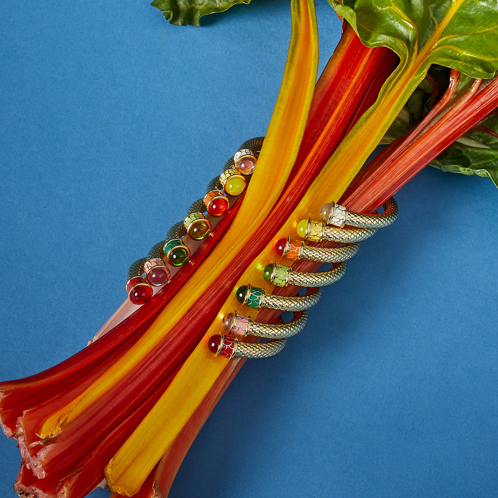 Image of Halcyon Days bangles clutching rhubarb