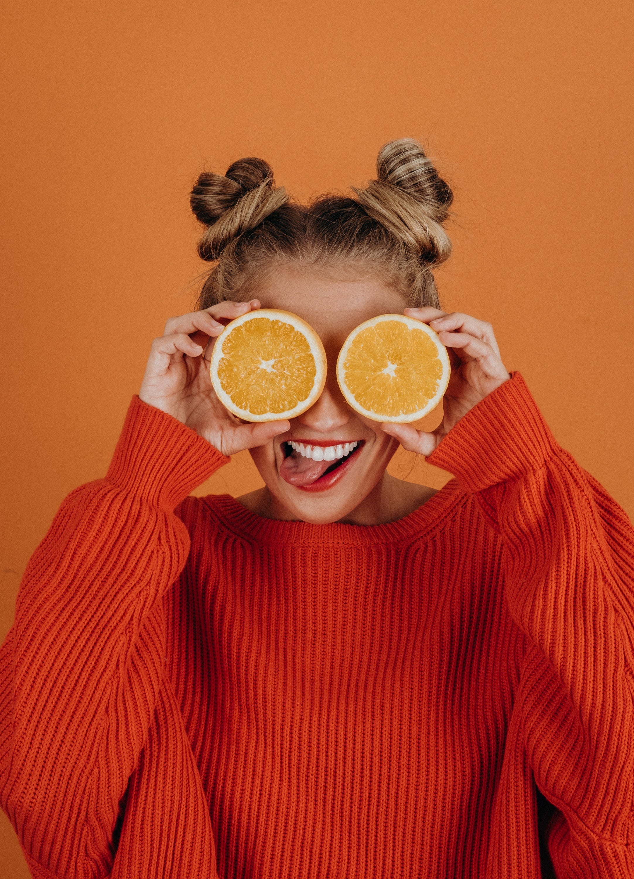 Girl holding oranges