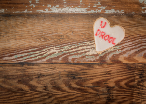 Vancouver Best Cookies- cookie written u drool on a wooden table