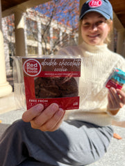 Student holding cookie