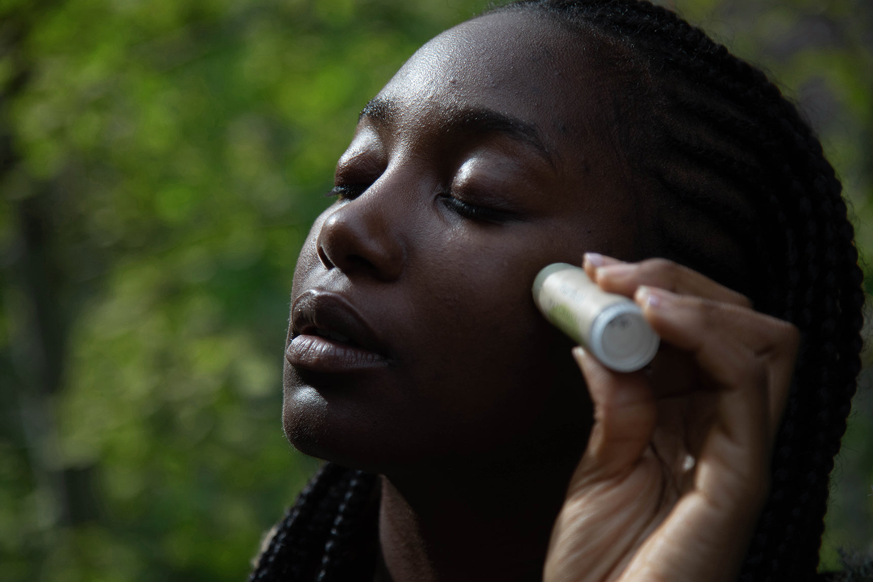 Patchouli Frankincense Rejuvenation Balm applying on face