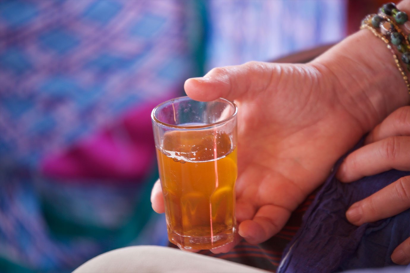 evans journey al amal womens cooperative morocco holding tea in glass