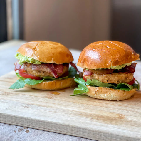 Free Range Chicken Burger B.L.T with Crushed Avocado and Lime. Recipe by Barry Horne. Provenance Butcher Deliveries.