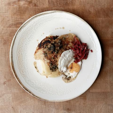 Chicken Schnitzel with caper brown butter, mash and a fried egg