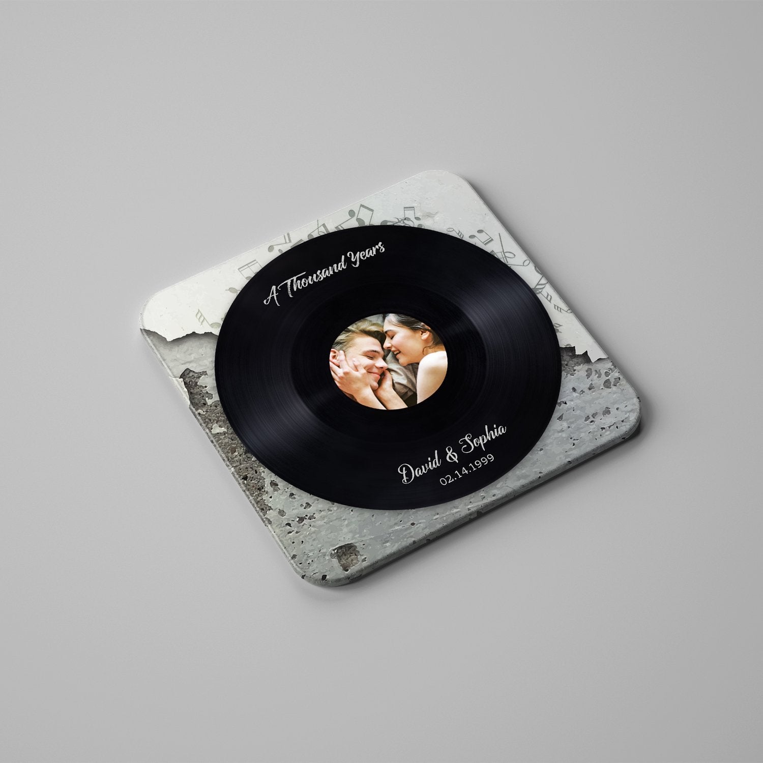 Featuring a black vinyl record pattern, this personalized coaster set is a creative gift for music lovers