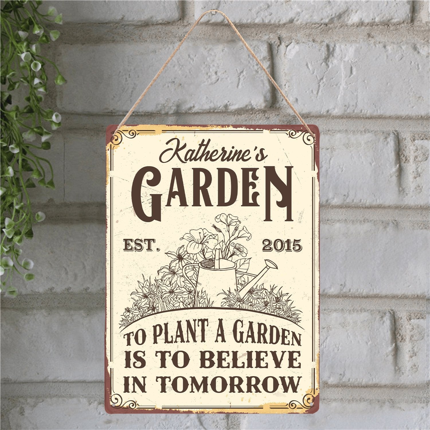 rectangular metal garden sign print family name, "To Plant A Garden Is To Believe In Tomorrow" phrase on a light bright color background