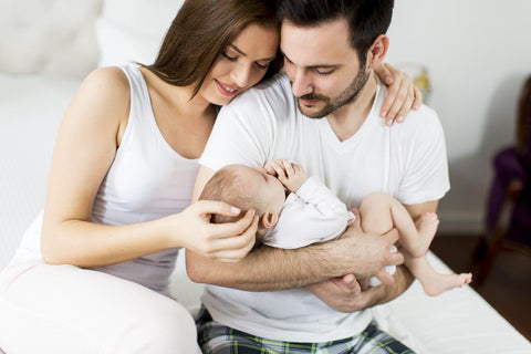 Sleeping baby with parents