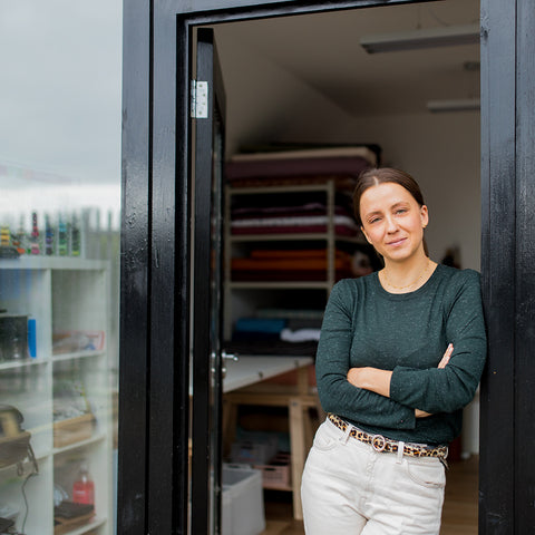 polina standing in the doorway to her studio