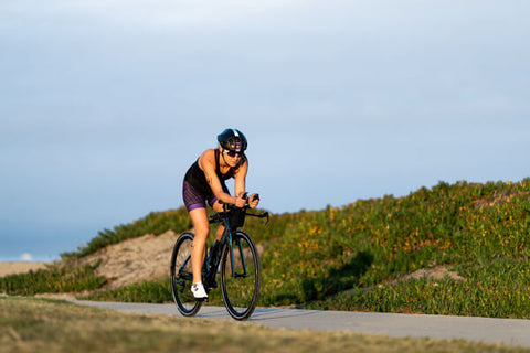 TRIATHLETE ON TRI BIKE SPRINTING