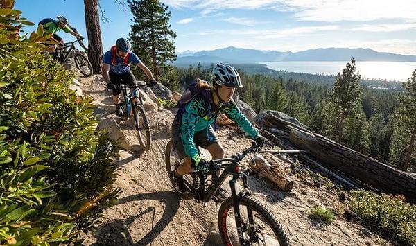 MOUNTAIN BIKERS RIDING ABOVE SOUTH LAKE TAHOE