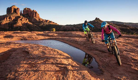 MOUNTAIN BIKERS RIDING IN SEDONA'S RED ROCKS