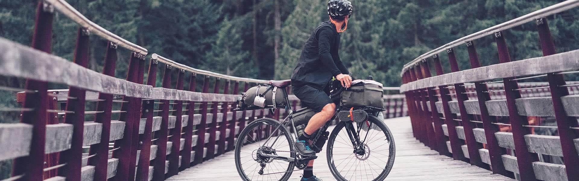 Bikepacker fully loaded on a touring bike.