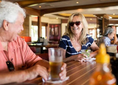 GUESTS AT THE BRIGANTINE BAR LAUGHING