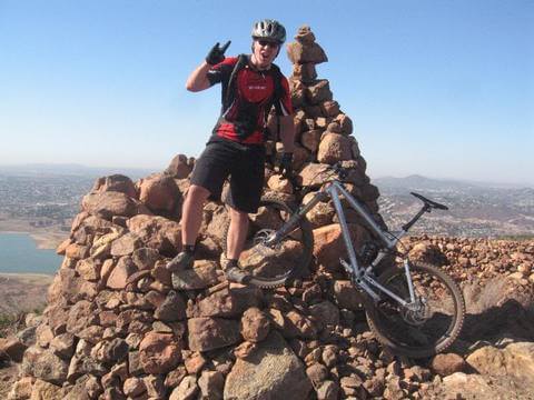 MOUNTAIN BIKER ON THE SUMMIT AT SWEETWATER