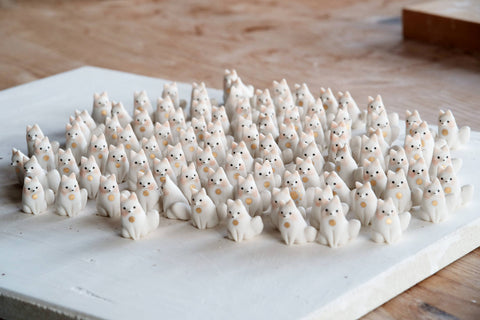 A big group of almost 90 handmade miniature porcelain foxes