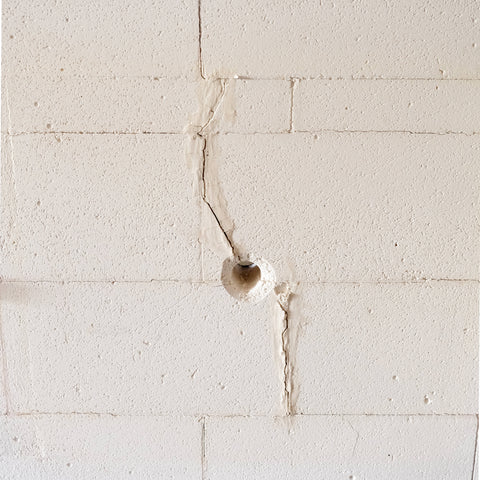 A vertical crack running down the inside of a kiln door