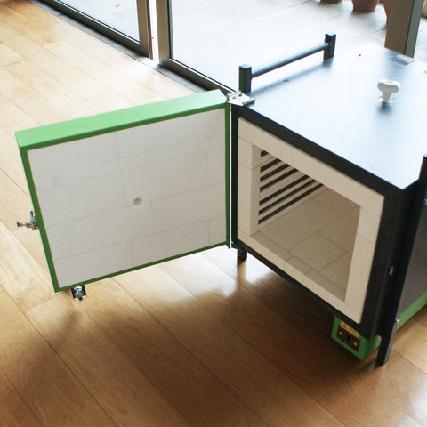 A front loading electric kiln with the door open
