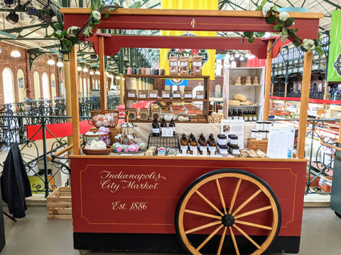 Display of soap and body products on red cart