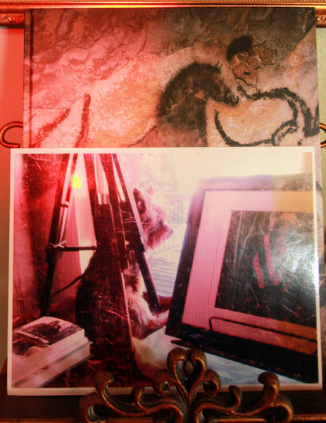 Vanilla Custard Pudding with cave art books and a photo of John Mayer