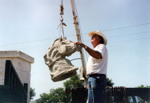 Rawlyn Richter Placing Horse Heads on our Ranch Spring 2005