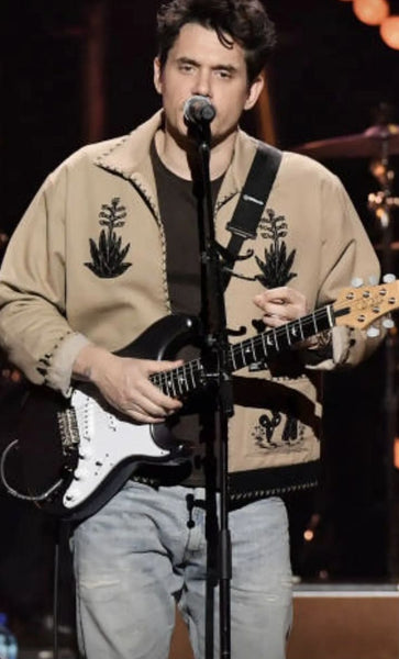 John Mayer in a Southwestern jacket performing at the Power of Love benefit concert 18 February 2023