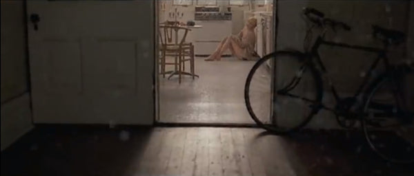 Taylor Swift replicating through the doorway on the floor from Faith Hill's Cry video