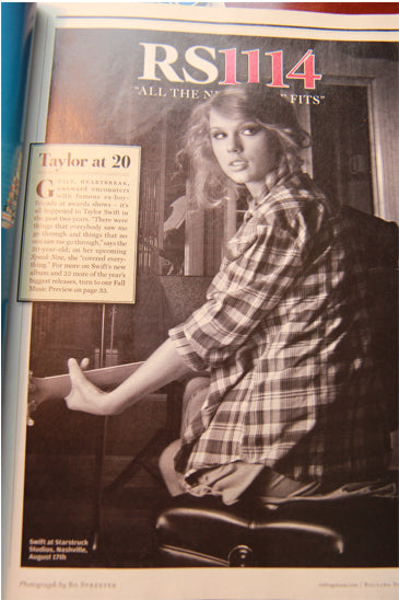 The “digital portal” into his living room: Taylor Swift, 17 August 2010, just a month before John’s interview with Mark Hoppus and him deleting his Twitter, she in a recording studio appearing in Rolling Stone dressed as John had been dressed in his apartment in his “Who Says” video.