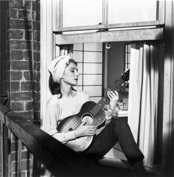 Audrey Hepburn singing "Moon River" on the fire escape in Breakfast at Tiffany's