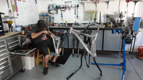 Will Montague, president of Guerrilla Gravity, reaming a seat tube on a mountain bike