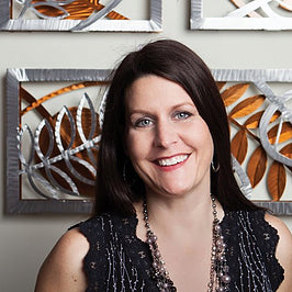 Sondra Gerber creator of Medal Petal Art, Wall Sculptures and Clocks in Aluminum