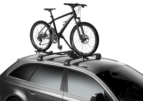 Thule Proride black holding a black mountain bike attached to a black car