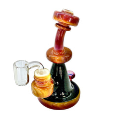 An example of an incredible heady glass bong. This one is our Serendipity Rig, blown by Baked Kreations Glass.