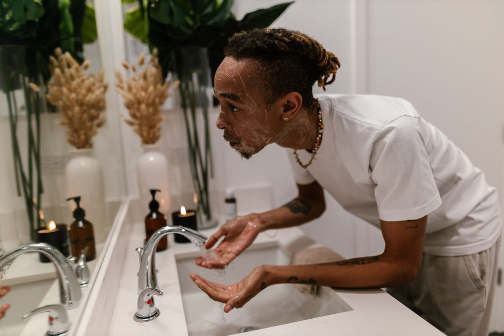 A man washing his face with a gentle cleanser