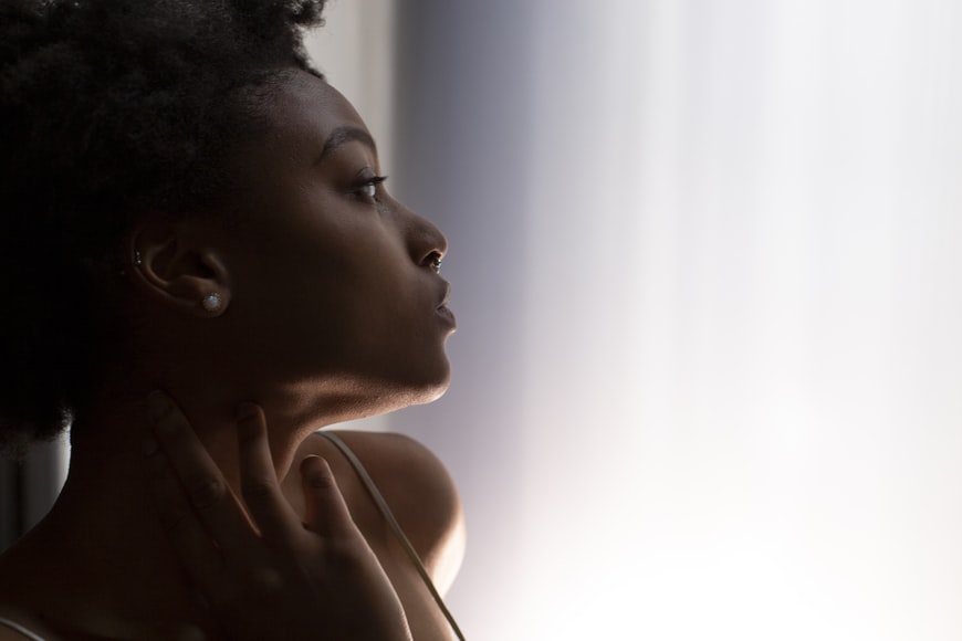 A portrait of a woman with healthy, darker skin