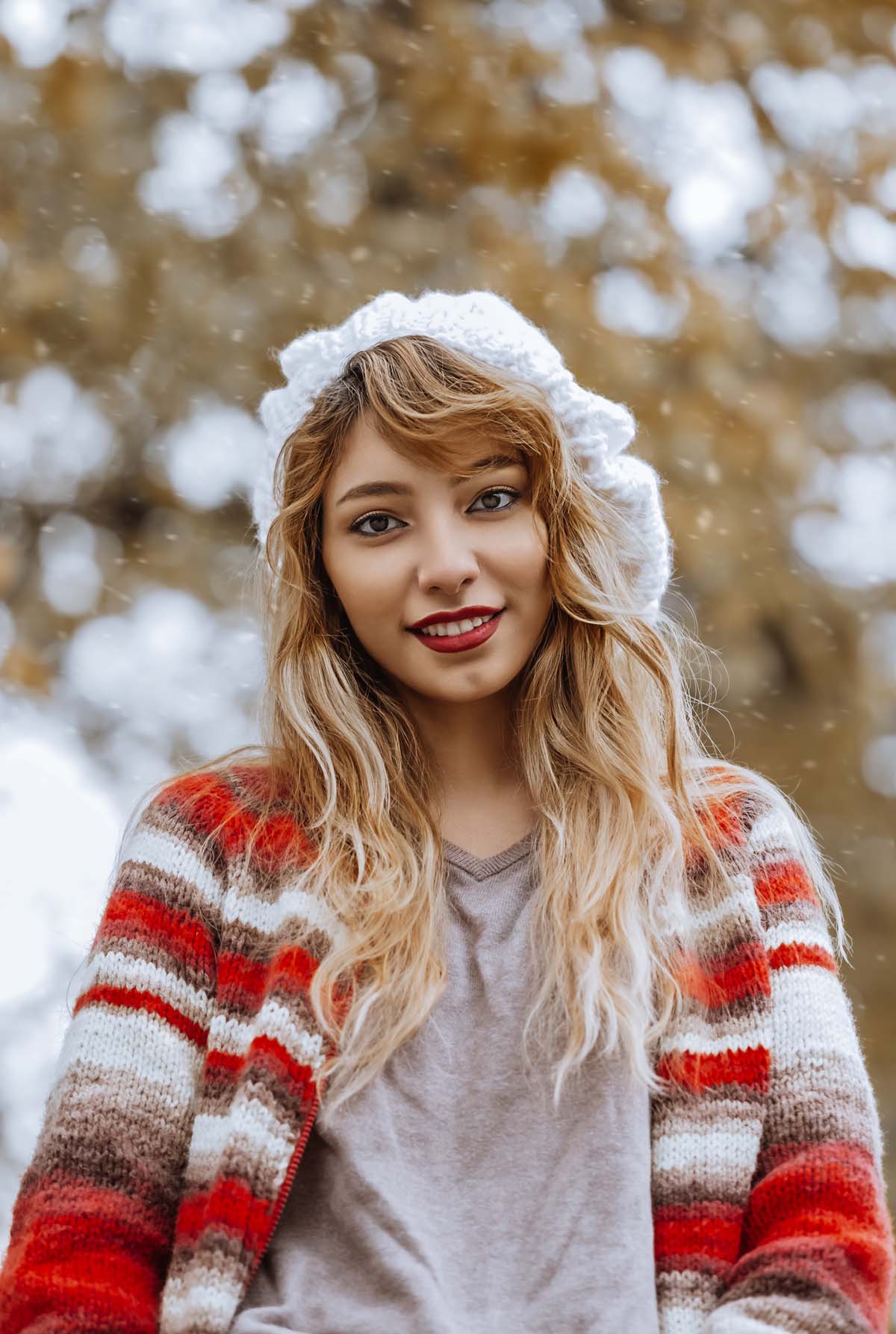 A woman in the snow with hyperpigmentation on her face