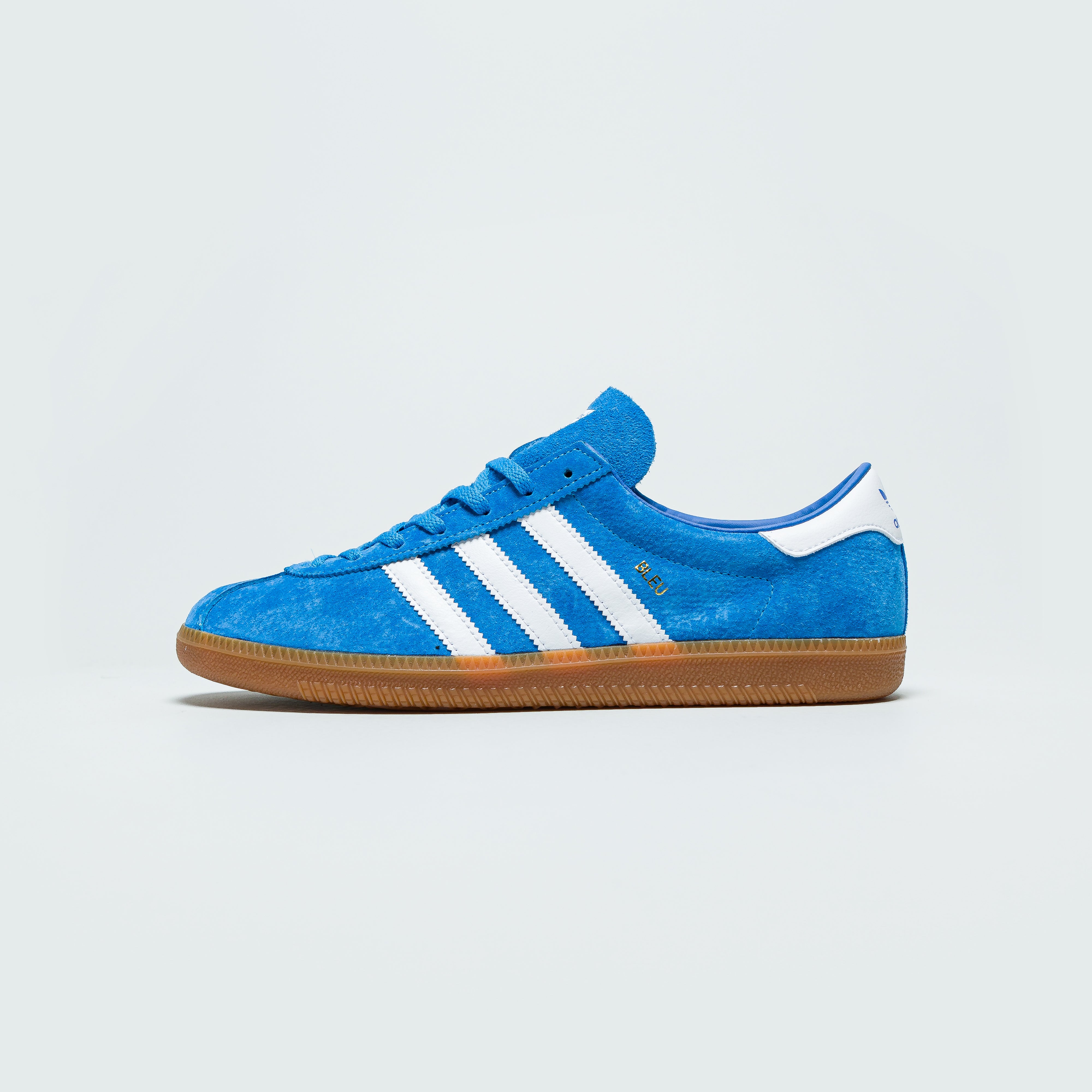 bright blue adidas trainers