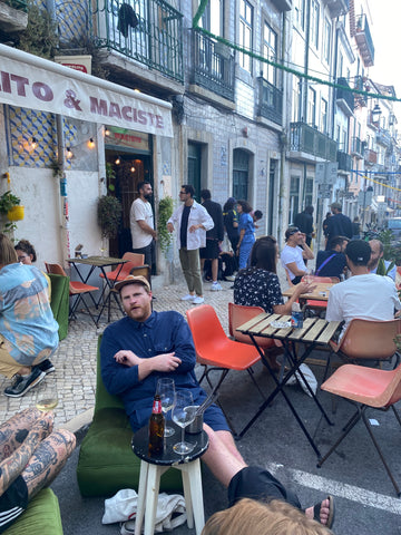 a man sitting on a terrace enjoing wine