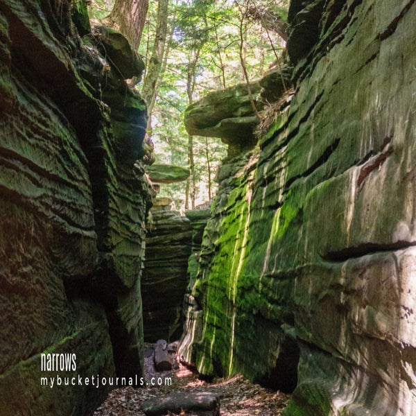 a narrow trail through rock outcroping