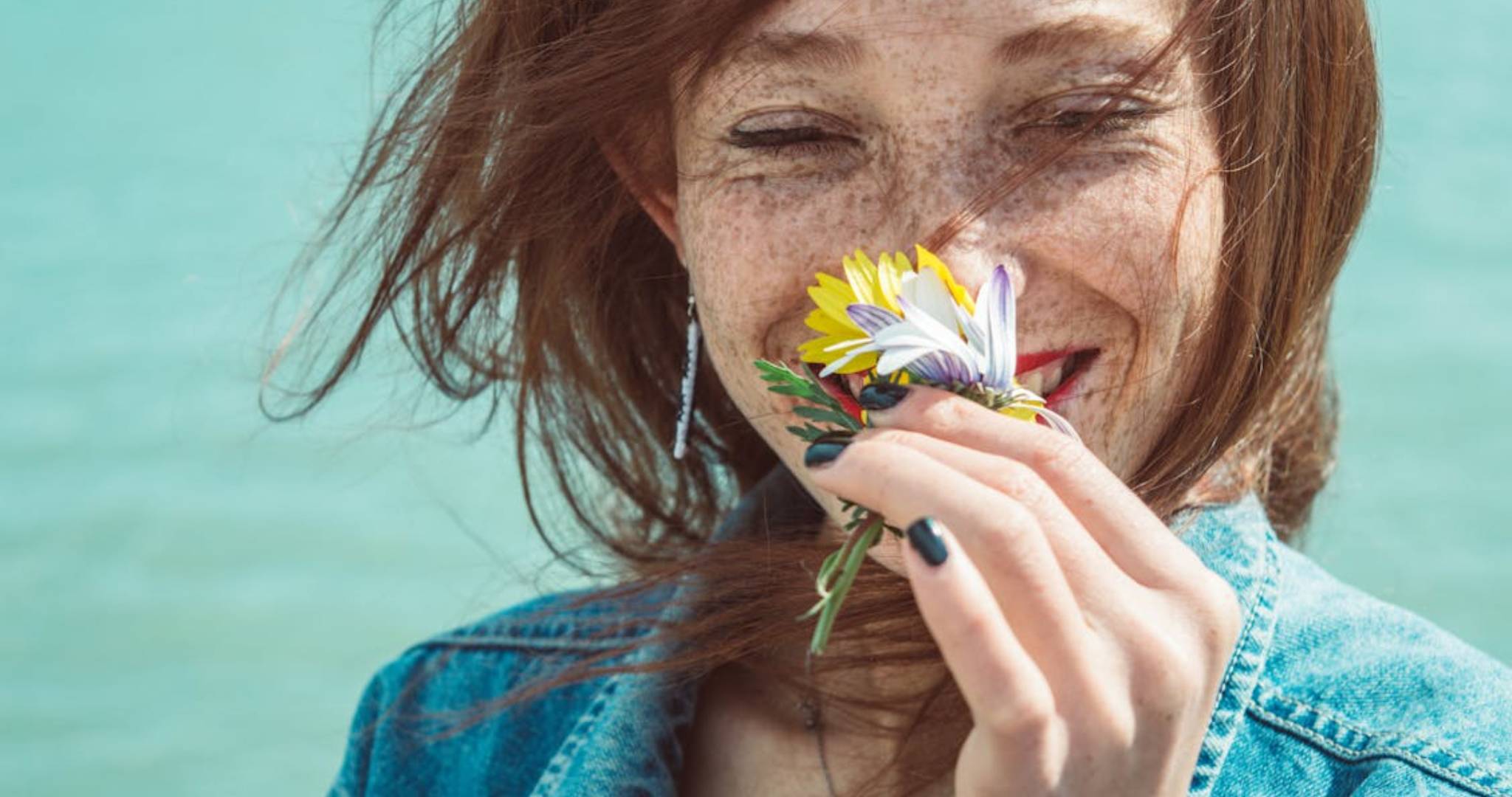 Woman smelling flowers