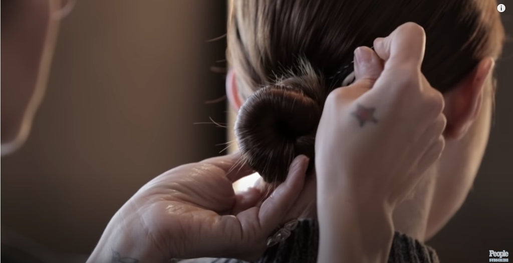 top knots hairstyles - side part sleek low bun