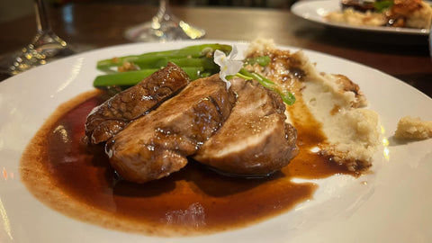 Pork tenderloin in adobo sauce and red wine reduction