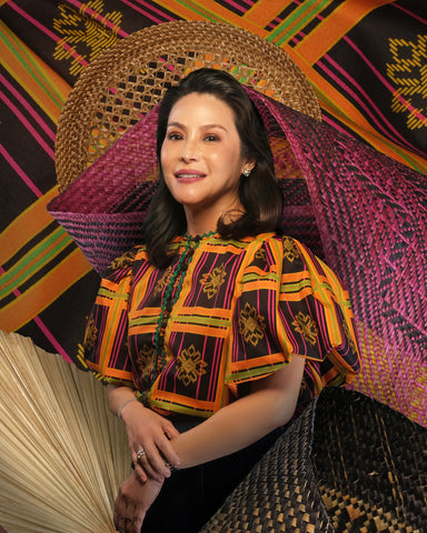 Restauranteur Ana de Ocampo wears a puff-sleeved printed top with zigzag ribbon trim.