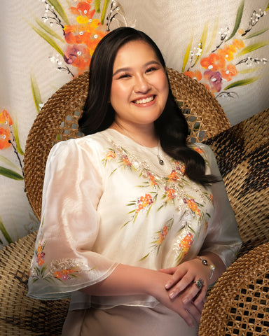 Mental health advocate Steph Naval wears a dainty handpainted floral organza kimona with a black pearl pendant necklace, a black and white pearl bangle, and a sterling silver ring. 