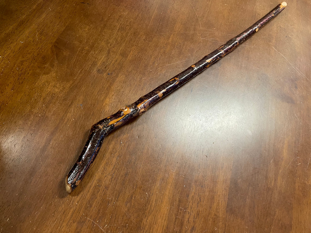 WALKING STICK, painted black wooden, handle i white metal, length 95 cm.