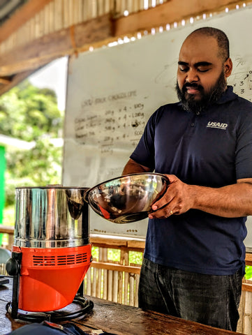 Even the Grameen Foundation Volunteer Coordinator got to make chocolate with the Chocolate Refiner in the Philippines.